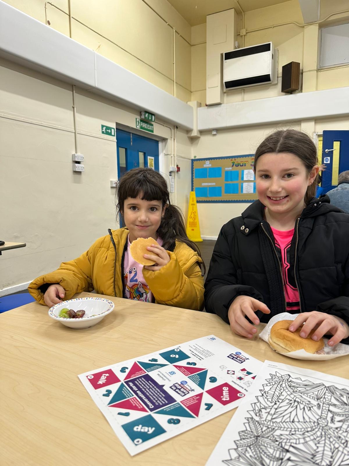 picture of children and adults enjoying the family breakfast